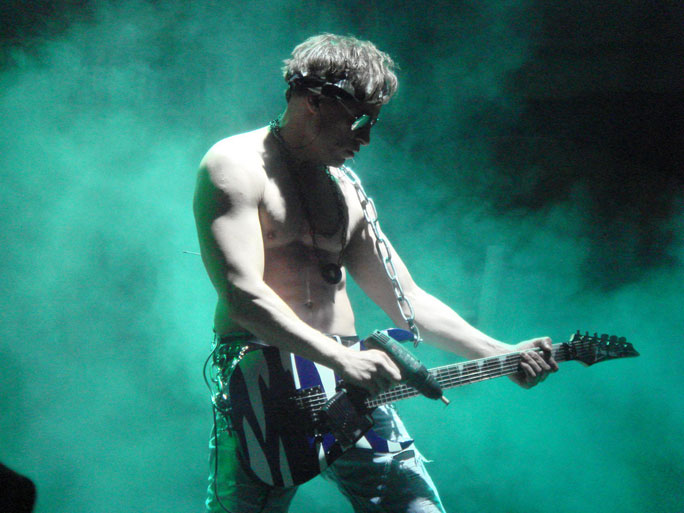 A guitarist playing on the guitar with drill. Vienna, Austria.